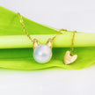 Charm - 18K Gold and Premium Pearl Pendant Necklace